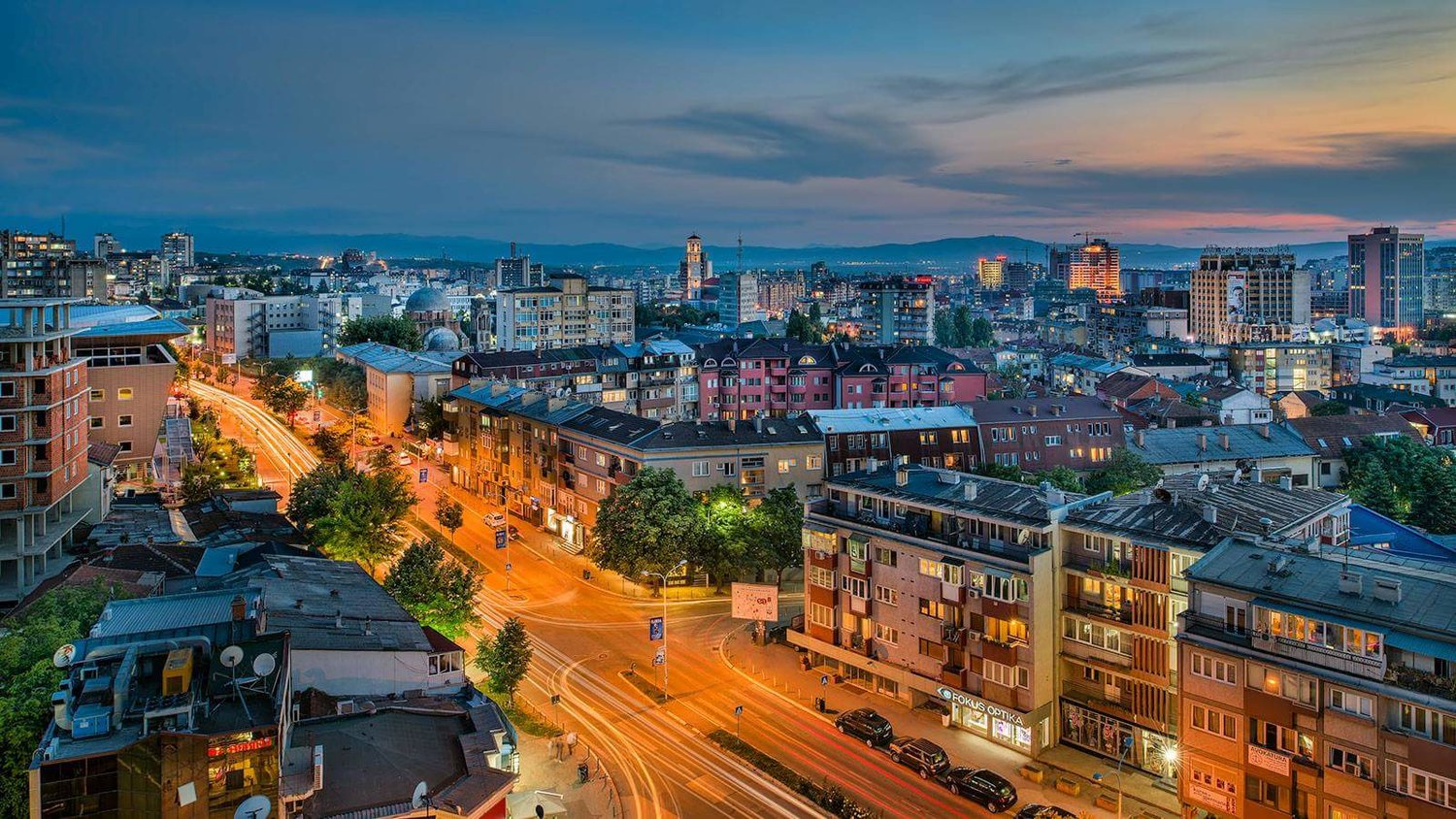 Vibrant street scene in Prishtina, showcasing its dynamic urban culture and architectural diversity.