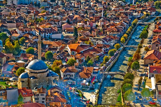 Panoramic view of Prizren cityscape with historic landmarks and vibrant atmosphere.